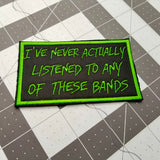 Four inch rectangular embroidered patch that says I've never actually listened to any of these bands.