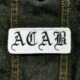 Black on white ACAB patch in old english lettering.