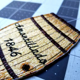 Cask of Amontillado embroidered patch, based on the short story by Edgar Allan Poe, show in close-up.