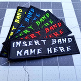 Patches that say insert band name here in various colors.