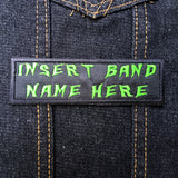 Green on black rectangular embroidered patch that says insert band name here.
