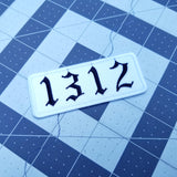 1312 embroidered patch in an old English font, black lettering on white material.