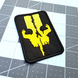 Yellow on black embroidered logo patch for the adventure boardgame The 7th Continent.