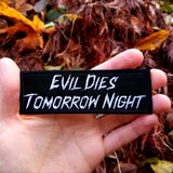 Embroidered patch reading evil dies tomorrow night, in reference to Halloween Kills.