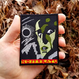 Embroidered patch of the movie poster for the classic silent horror film Nosferatu. Shown in the palm of a hand for size reference.