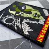 Close up detail of an embroidered patch of the movie poster for the classic silent horror film Nosferatu.