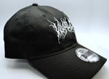 Right side view of a black baseball cap with a heavy metal style logo for the classical music composer Vivaldi embroidered on the front in white thread.
