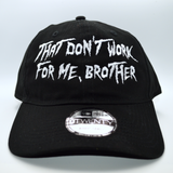 A black baseball cap with the phrase, that don't work for me, brother, embroidered in white thread on the front in large lettering.