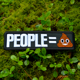 Rectangular black embroidered patch with that says people equals in white lettering followed by the poop emoji.