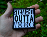 Square black and white embroidered patch that says straight outta mordor. Shown in the palm of a hand for size reference.