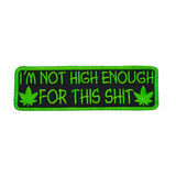Rectangular green on black embroidered patch that says I'm not high enough for this shit, along with two pot leaves.
