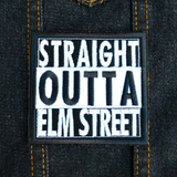 Square black and white embroidered patch that says straight outta elm street. Shown on a denim jacket.