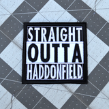 Square black and white embroidered patch that says straight outta haddonfield, inspired by the Halloween movie series.