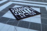 Close up detail of a square black and white embroidered patch that says straight outta LV-426.