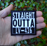 Square black and white embroidered patch that says straight outta LV-426. Shown in the palm of a hand for size reference.
