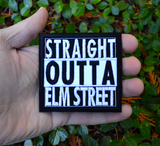 Square black and white embroidered patch that says straight outta elm street. Shown in the palm of a hand for size reference.