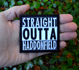 Square black and white embroidered patch that says straight outta haddonfield, inspired by the Halloween movie series. Shown in the palm of a hand for size reference.