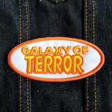 Yellow and orange on white embroidered patch of the title logo for the classic b horror and sci-fi movie Galaxy of Terror.