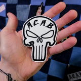 Black and white ACAB Punisher symbol patch.