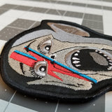 Embroidered patch of the Bat Boy wearing David Bowie makeup from Alladin Sane.