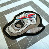 Embroidered patch of the Bat Boy wearing David Bowie makeup from Alladin Sane.