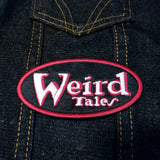 Embroidered patch of the logo for the classic horror and science fiction journal Weird Tales.