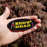 A Zed's Dead embroidered patch with a pair of pliers and a blowtorch, inspired by Quentin Tarantino's movie Pulp Fiction.