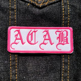 Pink and white ACAB patch in old english lettering.