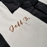 Custom name personalization embroidered on a black and stone colored bowling shirt inspired by the big lebowski.