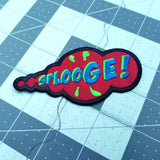 An embroidered patch in the shape of a comic book sound effect bubble with the word splooge.