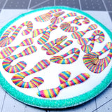 Circular embroidered patch with a bright green border, white background, and the words weird and silly in groovy rainbow lettering.