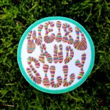 Circular embroidered patch with a bright green border, white background, and the words weird and silly in groovy rainbow lettering.