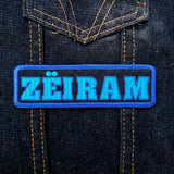 Rectangular two-tone blue on black embroidered logo patch for the cult classic Japanese sci-fi action movie Zeiram.