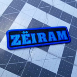 Rectangular two-tone blue on black embroidered logo patch for the cult classic Japanese sci-fi action movie Zeiram.