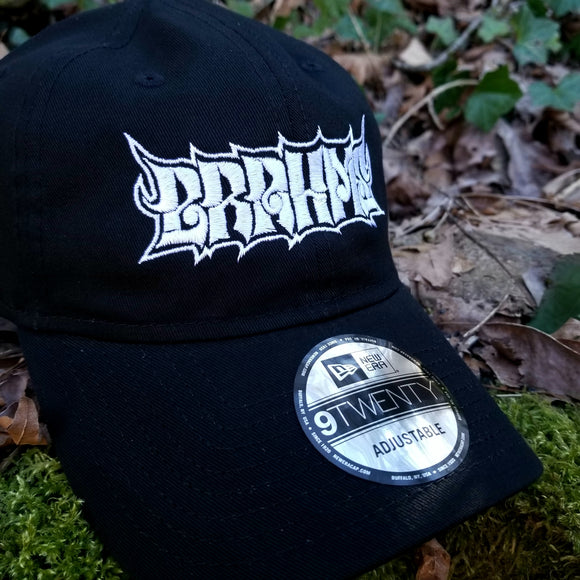 Black baseball cap with a heavy metal style logo for the classical music composer Brahms embroidered on the front in white thread.