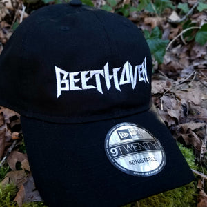 Black baseball cap with a heavy metal style logo for the classical music composer Beethoven embroidered on the front in white thread.