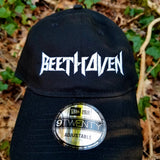 Black baseball cap with a heavy metal style logo for the classical music composer Beethoven embroidered on the front in white thread.