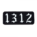 A white on black rectangular embroidered patches with the number 1312.