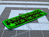 Close up detail of a rectangular green on black embroidered patch that says I'm not high enough for this shit, along with two pot leaves.