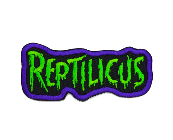 Embroidered patch with 'REPTILICUS' text in green on a black background with purple border.