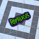 Embroidered patch with 'REPTILICUS' text in green on a black background with purple border.