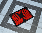 Rectangular black embroidered patch of the red hands of Manos, the Hands of Fate.