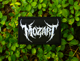 Rectangular white on black embroidered patch with the name of the classical music composer Mozart stylized to resemble a heavy metal band logo.