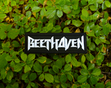Rectangular white on black embroidered patch with the name of the classical music composer Beethoven stylized to resemble a heavy metal band logo.