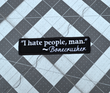 Rectangular black embroidered patch with a quote by Bonecrusher in white thread that says I hate people, man.
