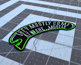 Close up detail of a black and green embroidered patch shaped like an alien head with the words, they mostly come at night, in grey thread.
