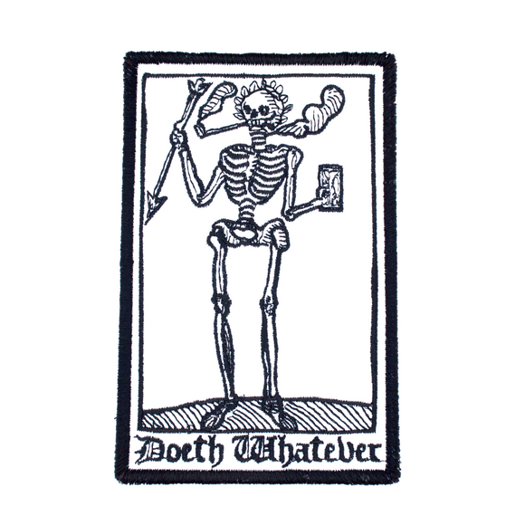 Rectangular black and white embroidered patch of a smoking skeleton in a medieval woodcut design style with the phrase doeth whatever spelled out in old English lettering.