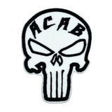 Black and white embroidered Punisher symbol patch with the letters a, c, a, b across the forehead.