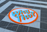 Close up detail of a circular white, blue, and orange embroidered patch with the phrase Why Tho?