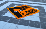 Close up detail of a rectangular orange and black embroidered patch for the classic horror movie black sunday.